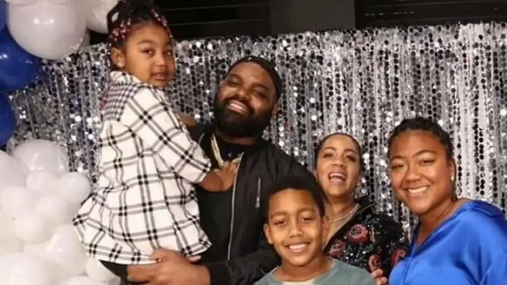 Michael Oher with his wife Tiffany Roy and kids