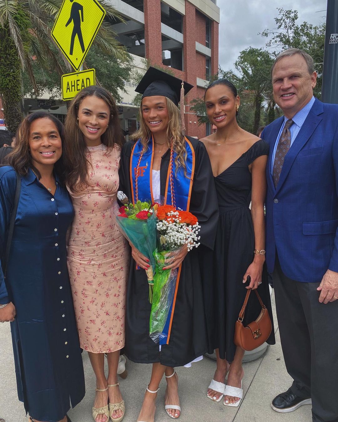 Anna Hall with her two older sisters and parents at her graduation